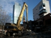 Canteena - The start of the demolition: the 350 cat high reach with pulverisor was used to demolish the lower two level block.